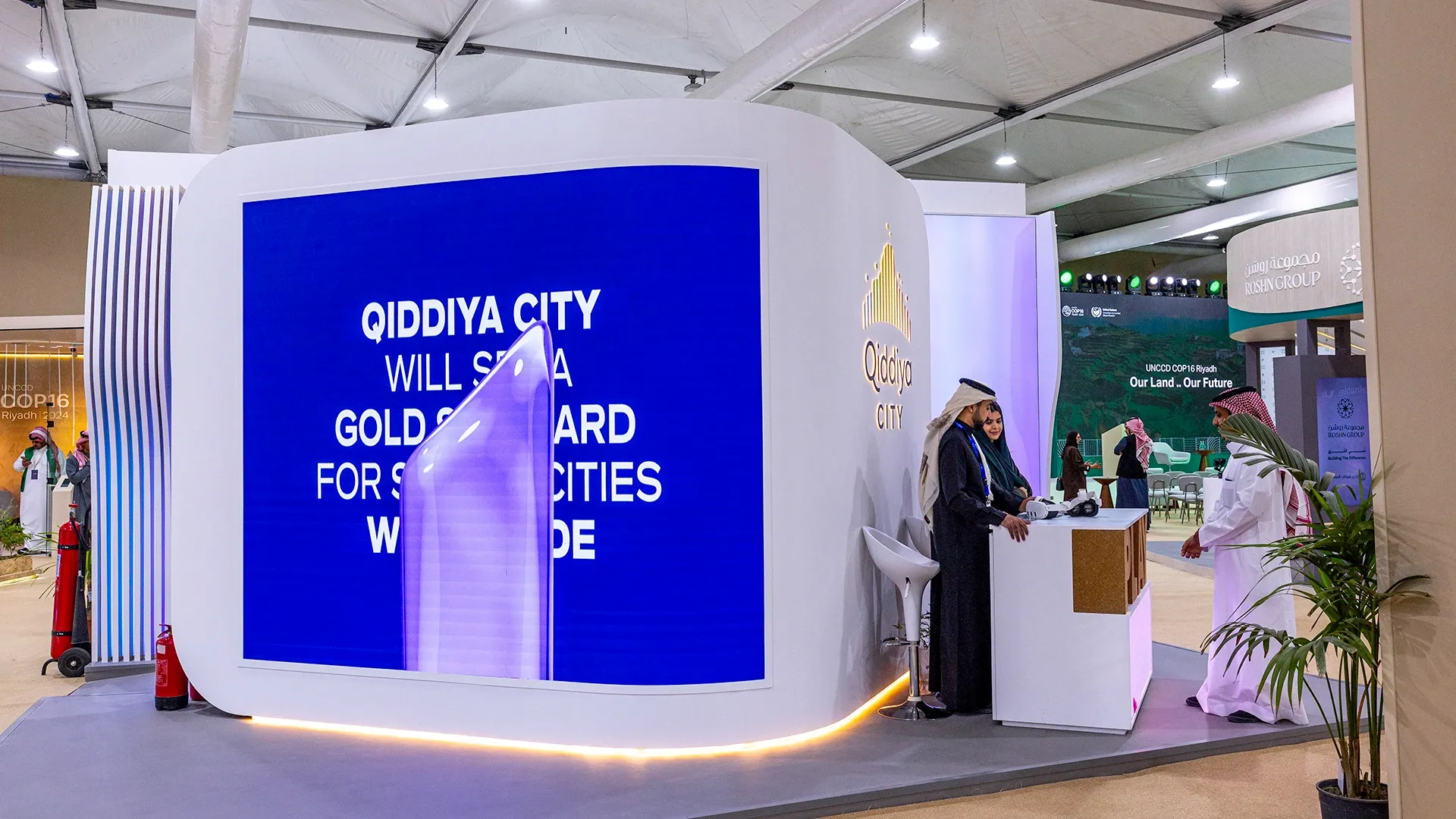 Visitors at the Qiddiya Investment Company stand at COP 16